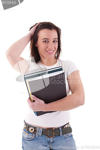 Image of female student smiling and holding notebooks