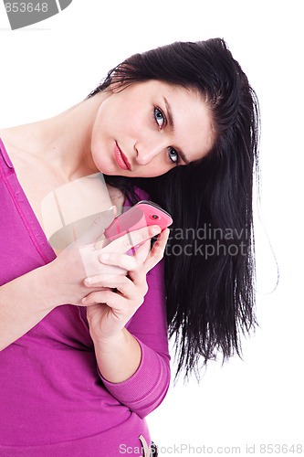 Image of beautiful young woman on the phone, looking at the camera