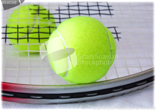 Image of Tennis Racket and Balls