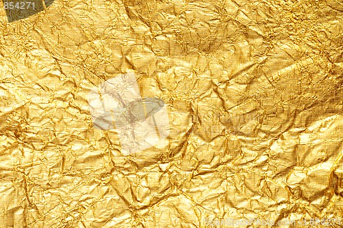 Image of Crumpled gold foil textured background