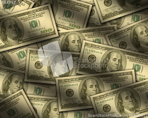 Image of One hundred dollar bills lying flat