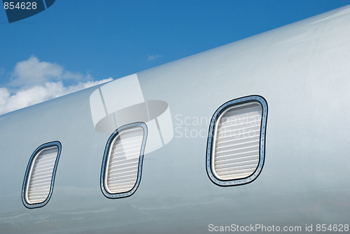 Image of Closed windows on gray metallic corporate jet