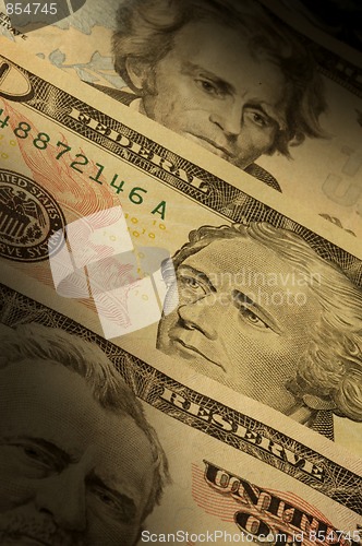 Image of U.S. banknotes of various dollar denominations ($20, $50 and $10