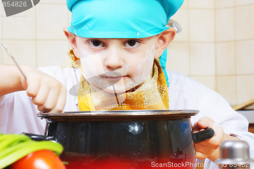 Image of Serious cook and pan