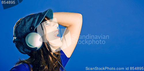 Image of Beautiful woman listening music