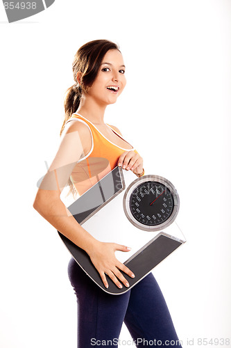 Image of Athletic girl with a scale