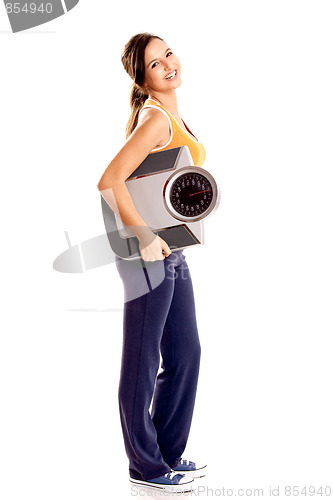 Image of Athletic girl with a scale