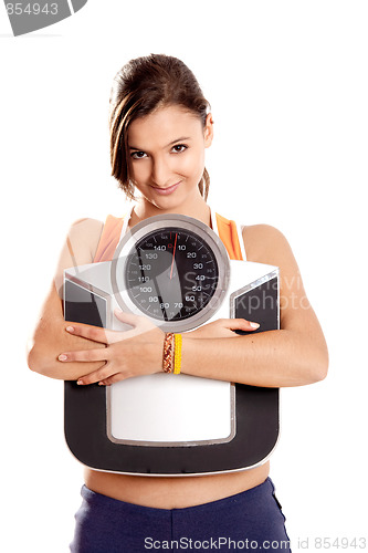 Image of Athletic girl with a scale