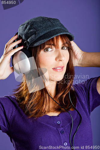 Image of Beautiful woman listening music