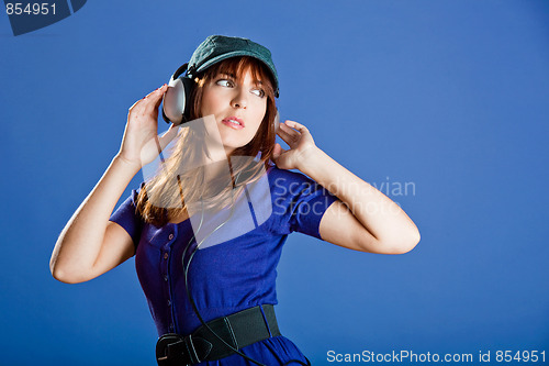 Image of Beautiful woman listening music