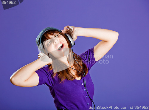 Image of Beautiful woman listening music