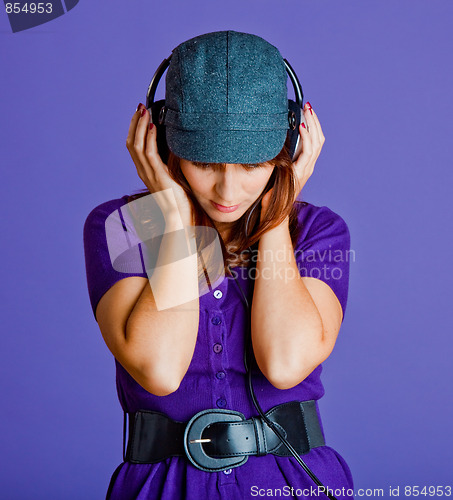 Image of Beautiful woman listening music