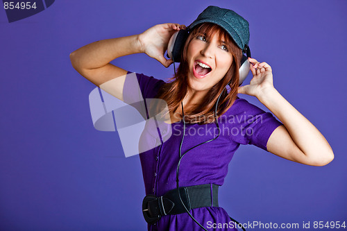 Image of Beautiful woman listening music