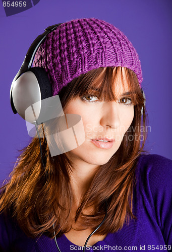 Image of Beautiful woman listening music