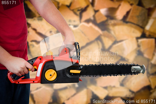 Image of Man Holding Chainsaw 