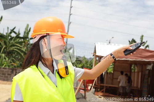 Image of Chinese construction engineer directing