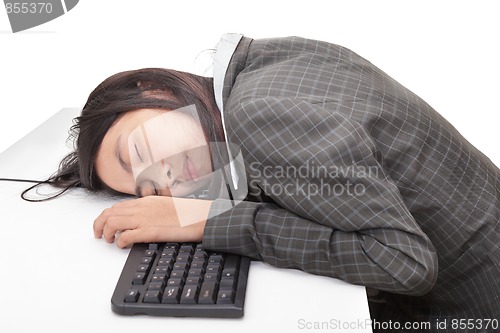 Image of Office worker sleeping on desk