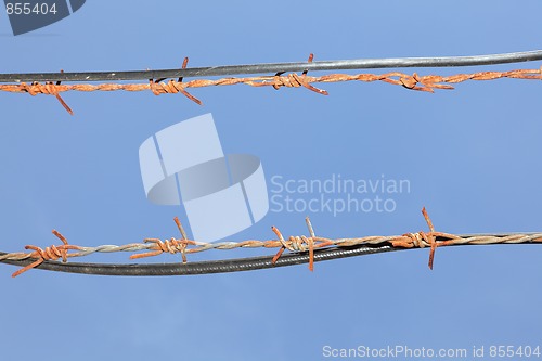 Image of Barbed wires in sky