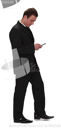 Image of Businessman checking the mobile phone