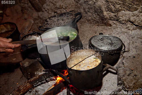 Image of Cooking Woman in A Hut