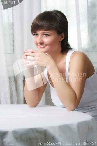 Image of Smiling woman with cup
