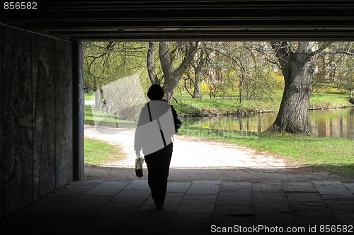 Image of Female walking at springtime