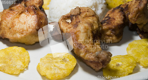 Image of fried chicken tostones and white rice