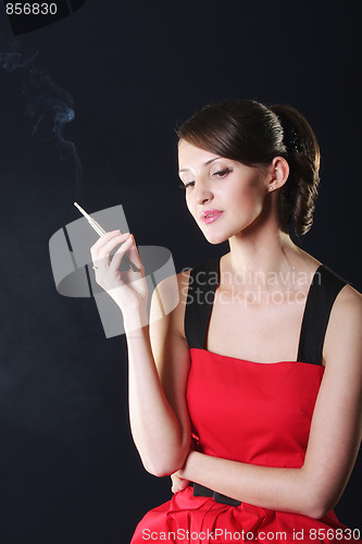 Image of Young woman in red with cigarette