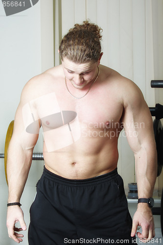 Image of Bodybuilder bending head