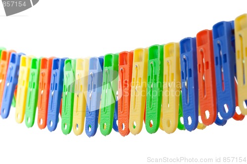 Image of Colorful row of clothes pegs