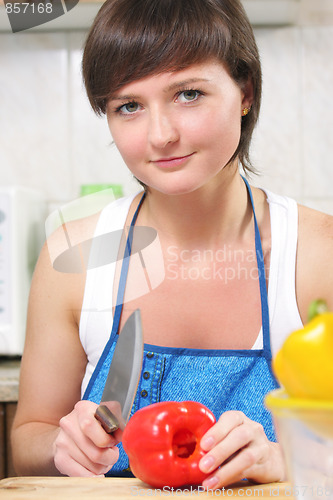 Image of Woman with paprika and knife