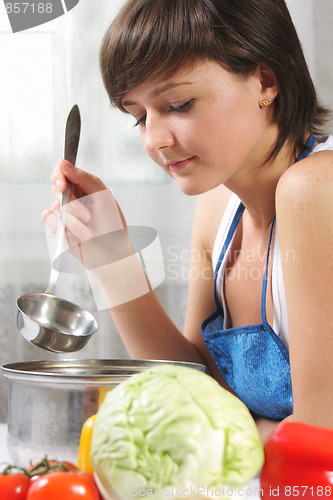 Image of Woman cooking food