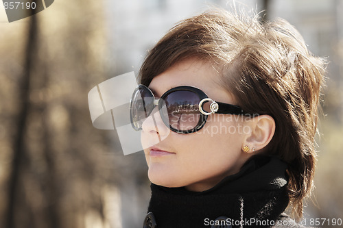 Image of Woman in sunglasses