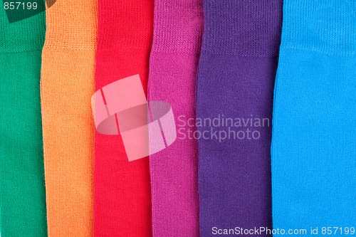 Image of Different color clothes lay in row