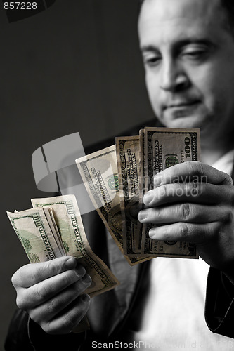 Image of Man Counting Cash