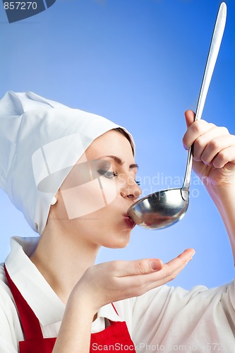 Image of Chef tasting soup from ladle