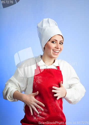 Image of Happy woman chef finished her work