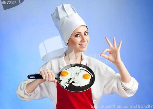 Image of Chef with pan and frying egg