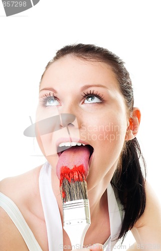 Image of Woman lick paint brush for fun