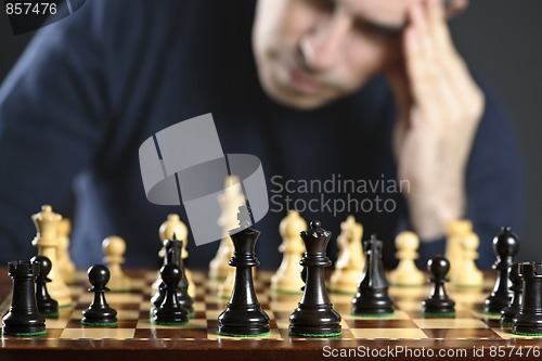 Image of Man at chess board