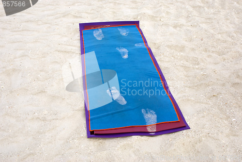 Image of yoga mat on beach