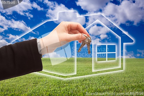 Image of Handing Over Keys on Ghosted Home Icon, Grass Field and Sky