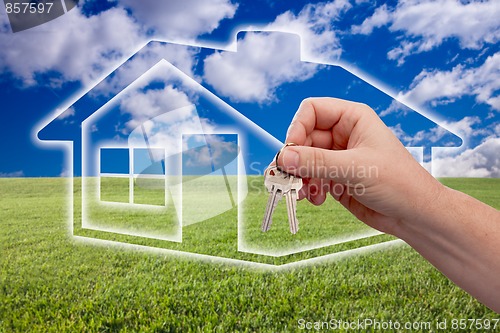 Image of Handing Over Keys on Ghosted Home Icon, Grass Field and Sky