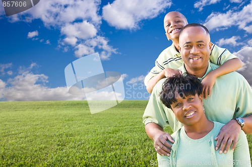 Image of Happy Family Over Grass Field, Clouds and Sky