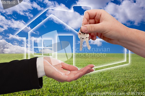 Image of Handing Over Keys on Ghosted Home Icon, Grass Field and Sky