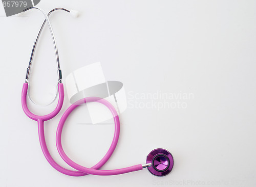 Image of pink stethoscope on white