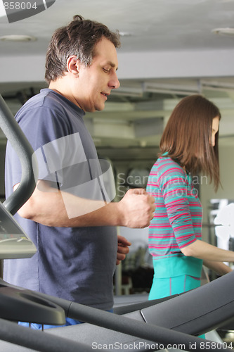 Image of People working out on treadmills