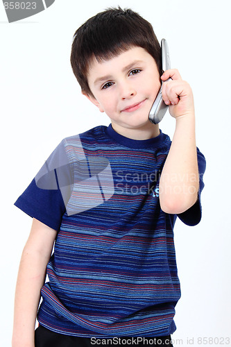 Image of Small boy calling from mobile phone