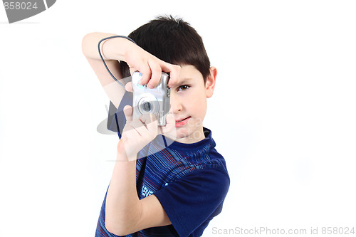 Image of small boy photographing vertical with digital camera
