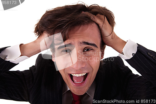 Image of Strongly afflicted young businessman keeps hands for head